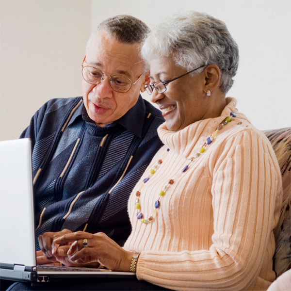 Elderly Couple Leaving Customer Feedback For Acorn Stairlifts